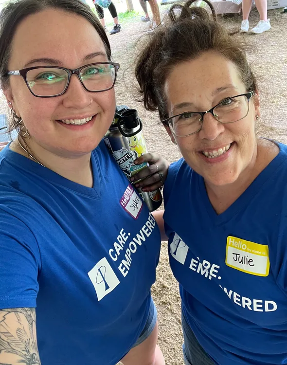 Sydney + Julie volunteering in Phia Care. Empowered. shirts