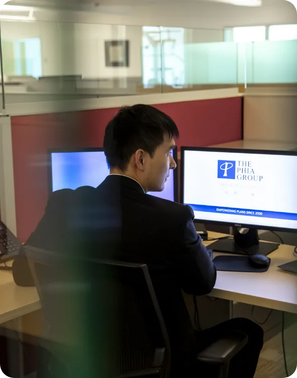 Worker looking at screens